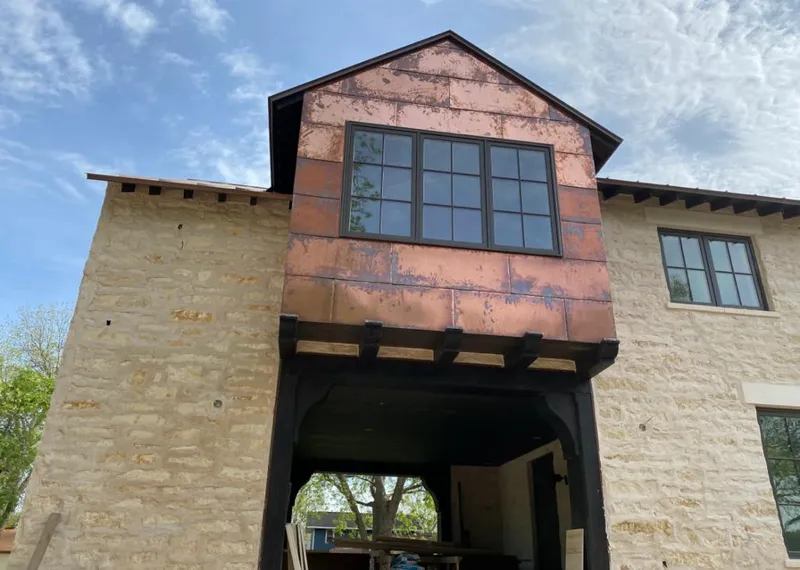 Copper metal panel facade on a stone building for Metal Roof Coating in Lynwood