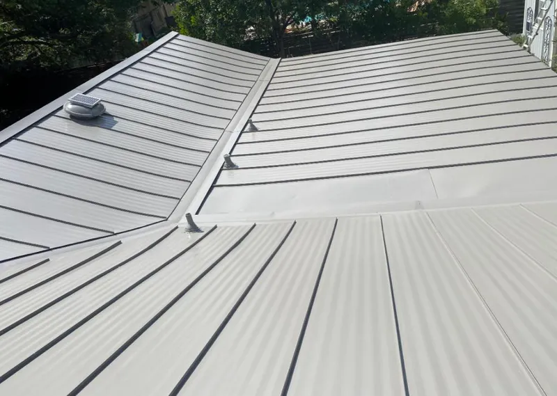 Solar attic fan installed on a metal roof for Roof Ventilation in Lynwood